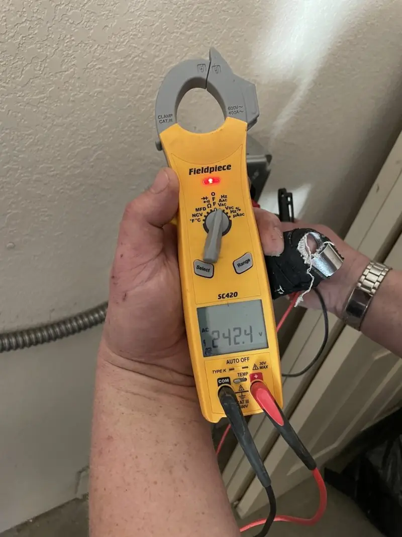 Voltage testing with clamp meter during Electrical Installation Services in Fernandina Beach
